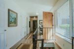 Stairs near the front doors take you down to the bonus room and additional 2 bedrooms